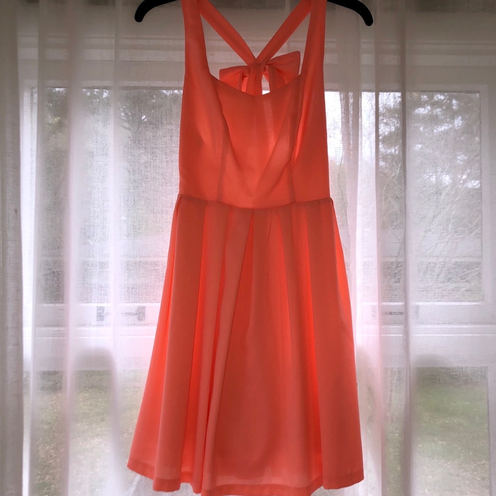 Boutique dress with bow and criss cross back